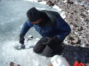 A guide draws water from an ice-covered glacial pond at 19,000 feet, during my climb up Aconcagua. Is this water tainted with carcinogens?